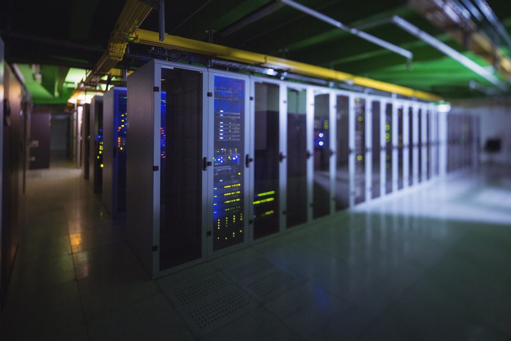 Hallway with a row of servers in server room